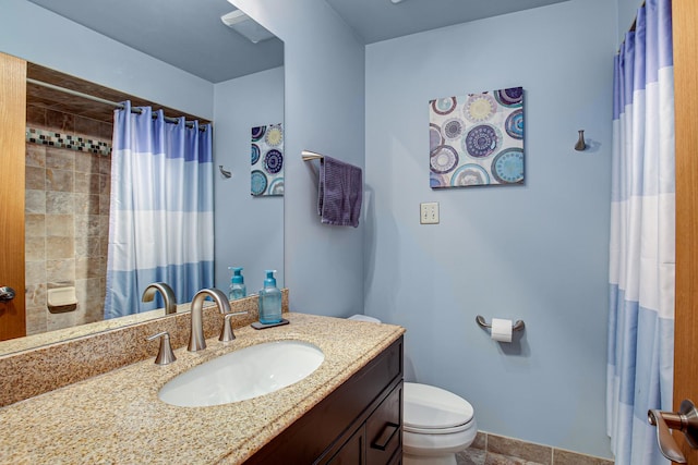 bathroom with vanity, toilet, and a shower with shower curtain