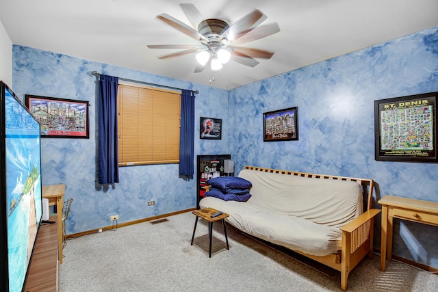 sitting room featuring ceiling fan and carpet floors