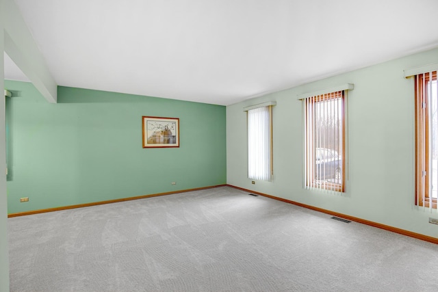 empty room with light colored carpet