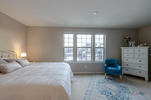 bedroom featuring light colored carpet