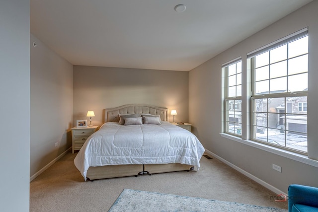 bedroom with light colored carpet