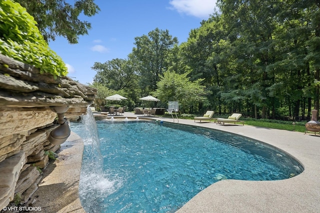 outdoor pool featuring a patio