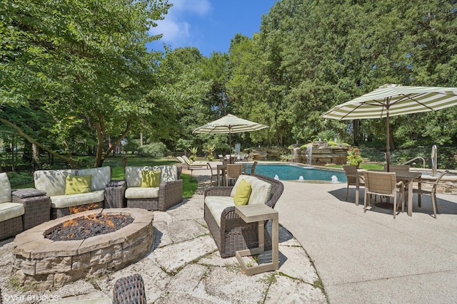 view of patio / terrace featuring an outdoor living space with a fire pit