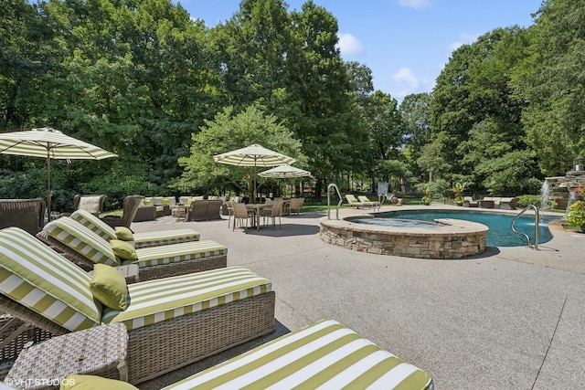 view of swimming pool featuring an in ground hot tub, outdoor lounge area, and a patio