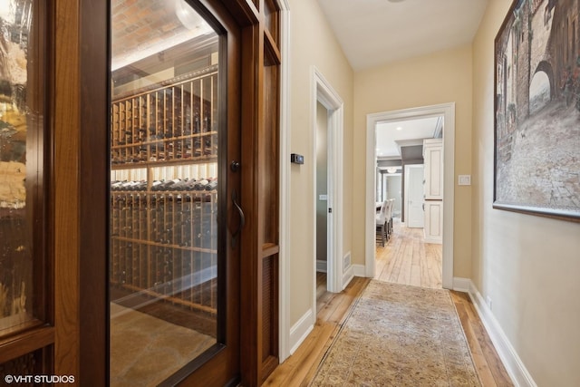 wine room with light hardwood / wood-style flooring