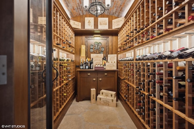 wine room with brick ceiling and lofted ceiling