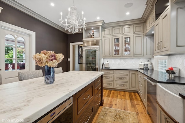 kitchen with glass insert cabinets, light wood finished floors, wine cooler, and ornamental molding