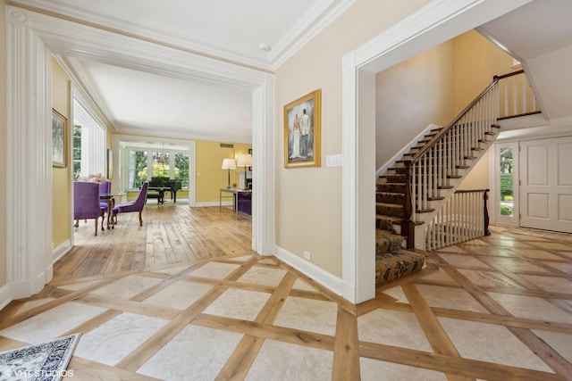 hallway with crown molding, stairway, baseboards, and wood finished floors