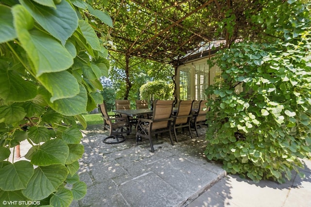 view of patio featuring outdoor dining area