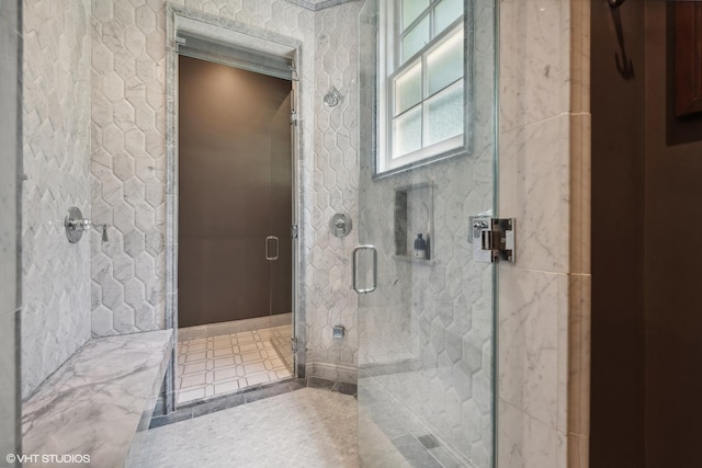 bathroom featuring a stall shower and tile patterned floors