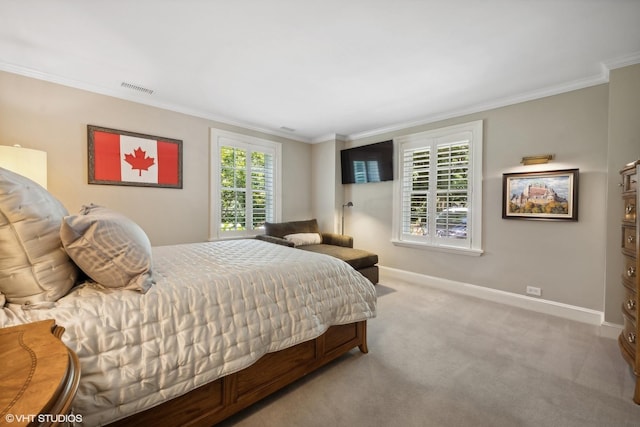 bedroom featuring carpet floors, ornamental molding, visible vents, and baseboards