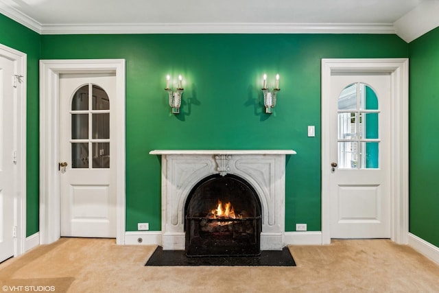 unfurnished living room featuring ornamental molding, carpet, and a fireplace