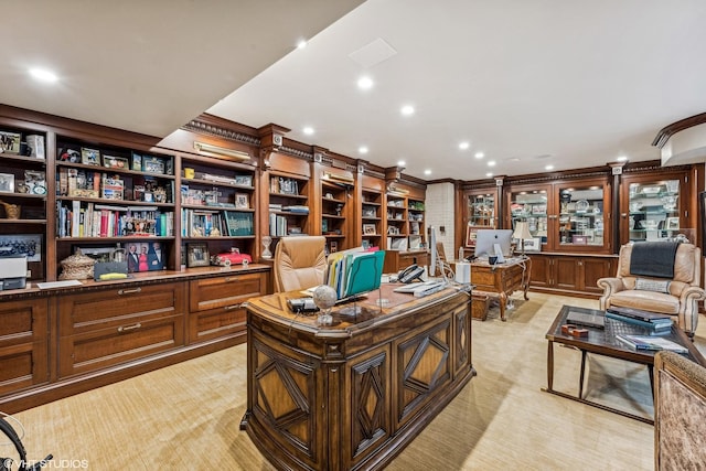 office with recessed lighting and light colored carpet