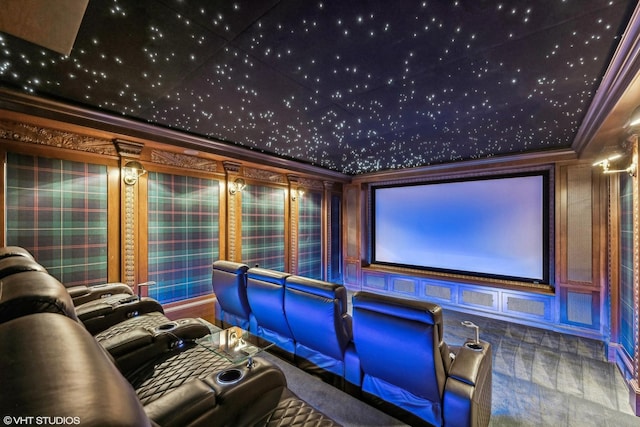 home theater room with ornamental molding