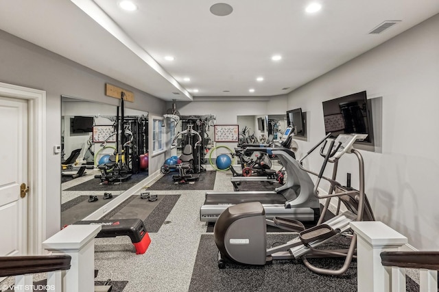 exercise room featuring visible vents and recessed lighting