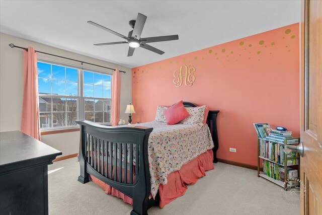 bedroom featuring ceiling fan and light colored carpet