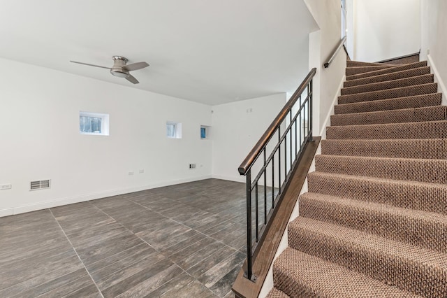 stairway with ceiling fan