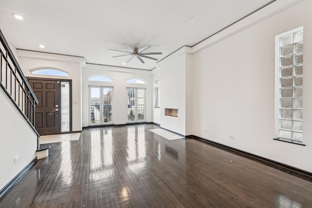 entryway featuring ceiling fan, crown molding, and dark hardwood / wood-style flooring