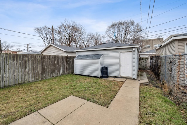 view of outbuilding with a yard