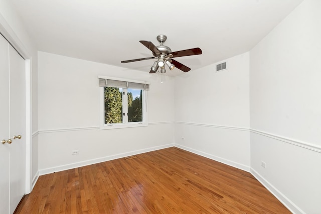 spare room featuring hardwood / wood-style flooring and ceiling fan