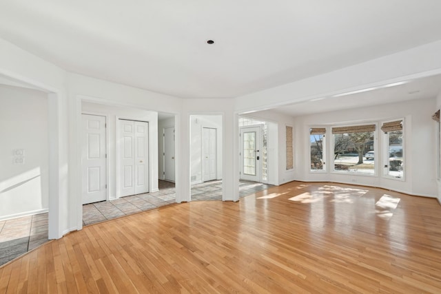 unfurnished room with light wood-type flooring