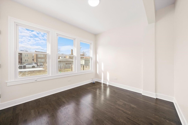 empty room featuring dark hardwood / wood-style floors