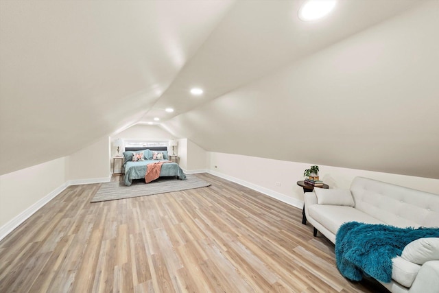 interior space featuring lofted ceiling and light wood-type flooring