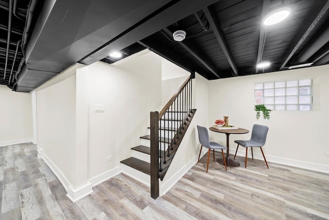 stairway featuring hardwood / wood-style floors