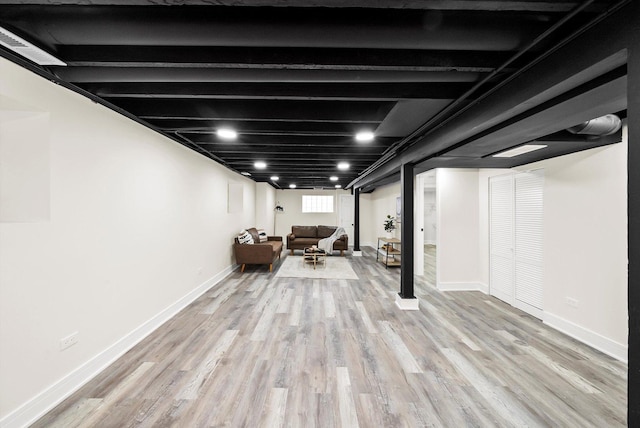 basement featuring light wood-type flooring