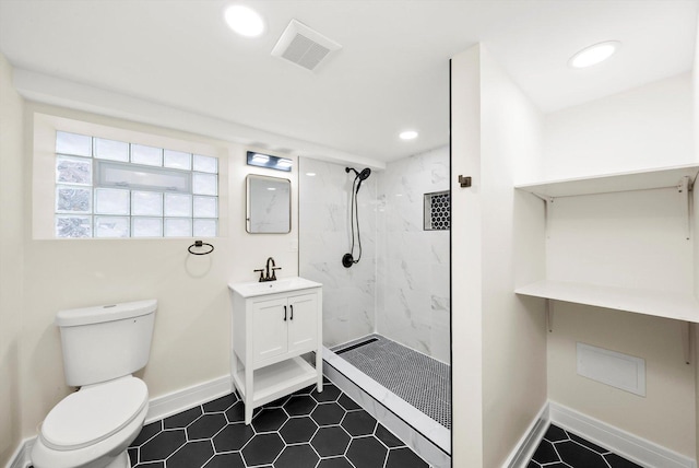 bathroom featuring toilet, a tile shower, vanity, and a baseboard radiator