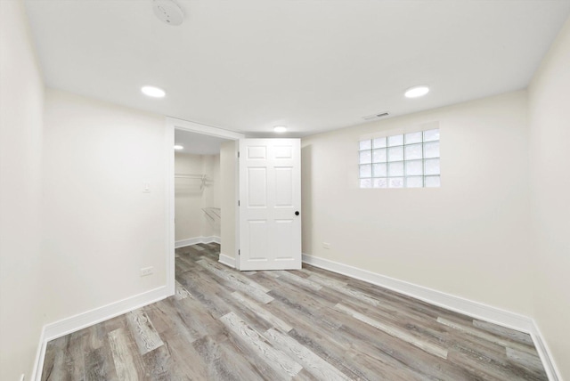 basement featuring light hardwood / wood-style floors