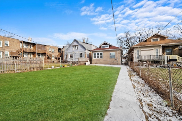 rear view of house with a yard