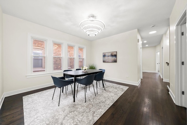 dining room with dark hardwood / wood-style flooring