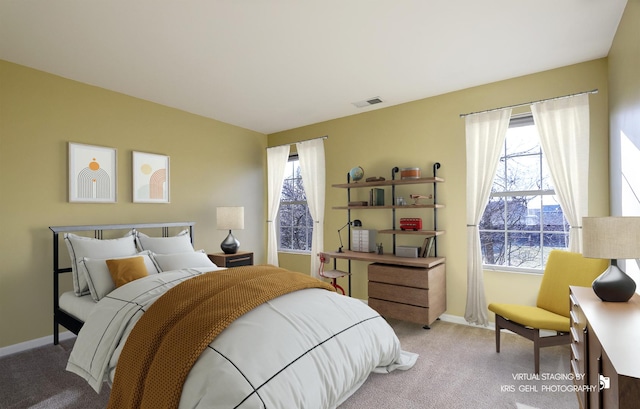 bedroom featuring light colored carpet