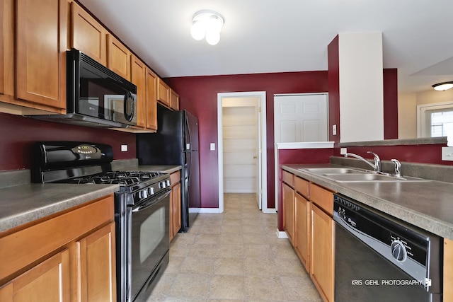 kitchen featuring sink and black appliances