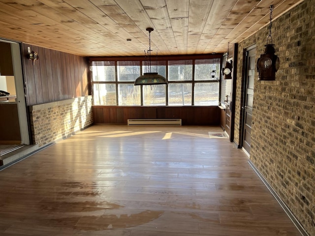 unfurnished sunroom with wooden ceiling and baseboard heating