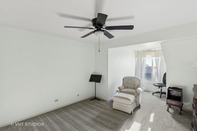 living area with ceiling fan and light carpet