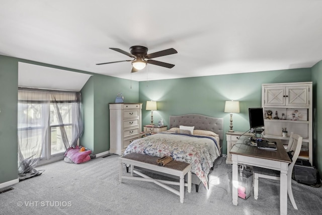 bedroom with light carpet, ceiling fan, and vaulted ceiling