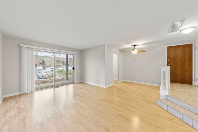 unfurnished living room featuring light hardwood / wood-style floors and ceiling fan