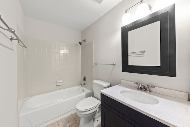 full bathroom with toilet, tiled shower / bath combo, tile patterned floors, and vanity