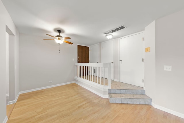 spare room with ceiling fan and light hardwood / wood-style flooring