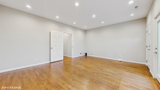 unfurnished room with light hardwood / wood-style floors