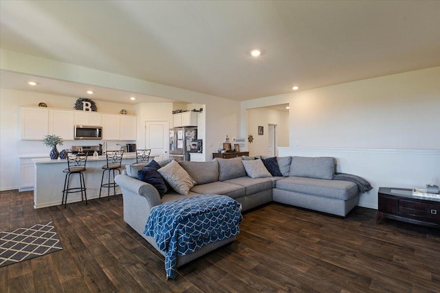 living room featuring dark wood-type flooring