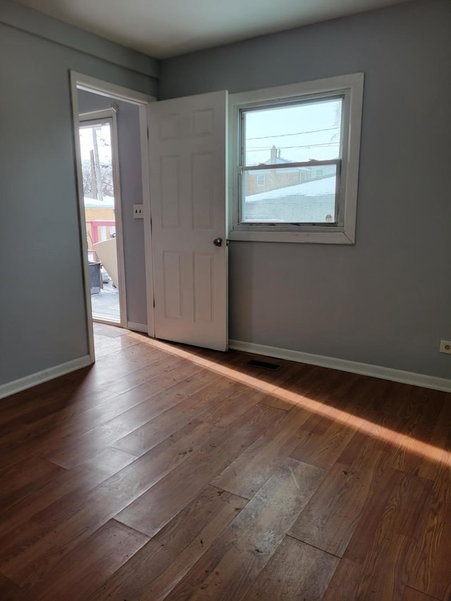 foyer with dark wood-type flooring