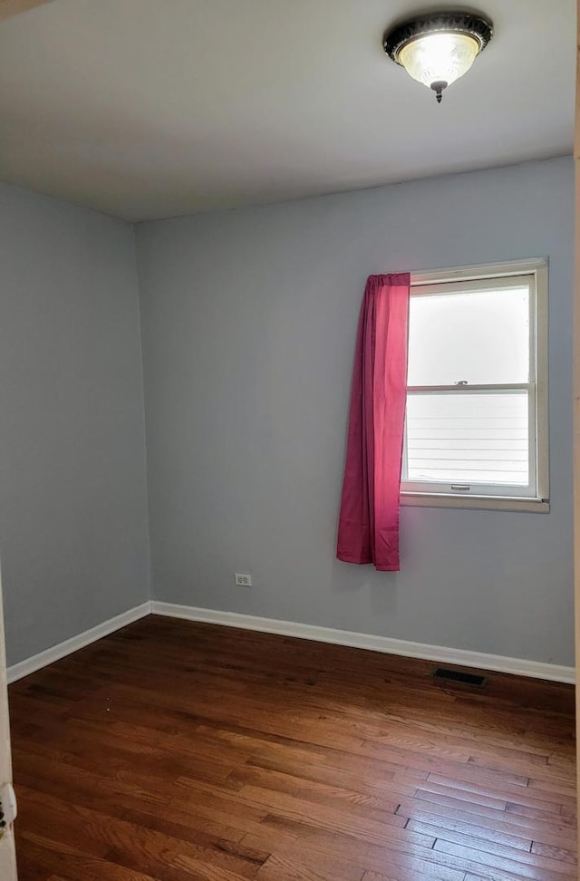 empty room featuring hardwood / wood-style floors