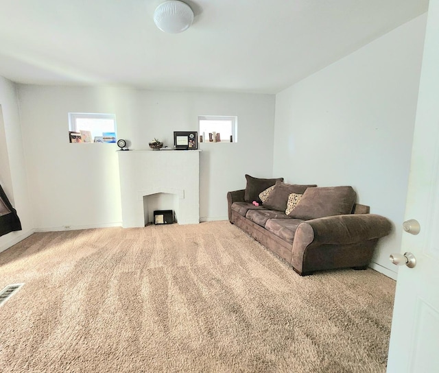 carpeted living room featuring a healthy amount of sunlight