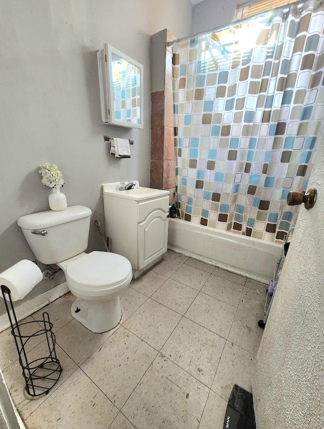 full bathroom featuring toilet, sink, and shower / bath combination with curtain