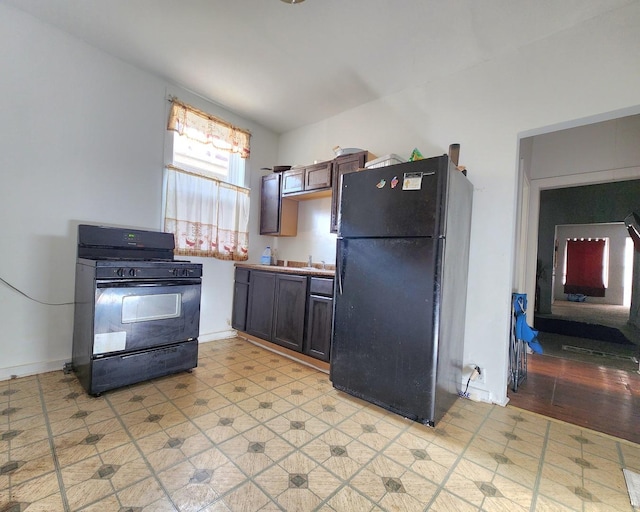 kitchen with sink and black appliances