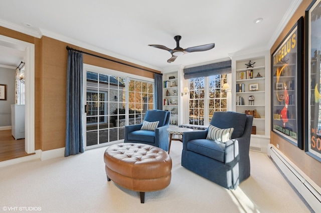 living area with ceiling fan, baseboard heating, carpet floors, and ornamental molding