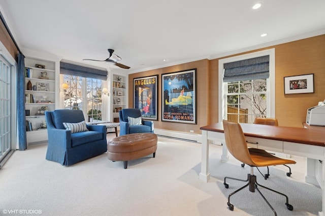 office featuring light carpet, a healthy amount of sunlight, and built in shelves